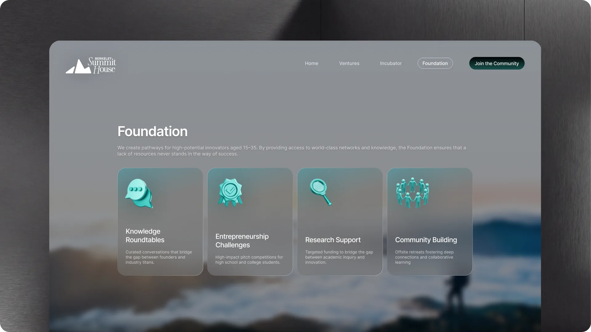 Foundation page — four support programs on frosted cards